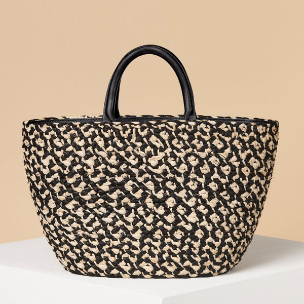 http://kassatex.com/cdn/shop/products/cesta-top-handle-raffia-tote-black-1_grande.jpg?v=1678999863